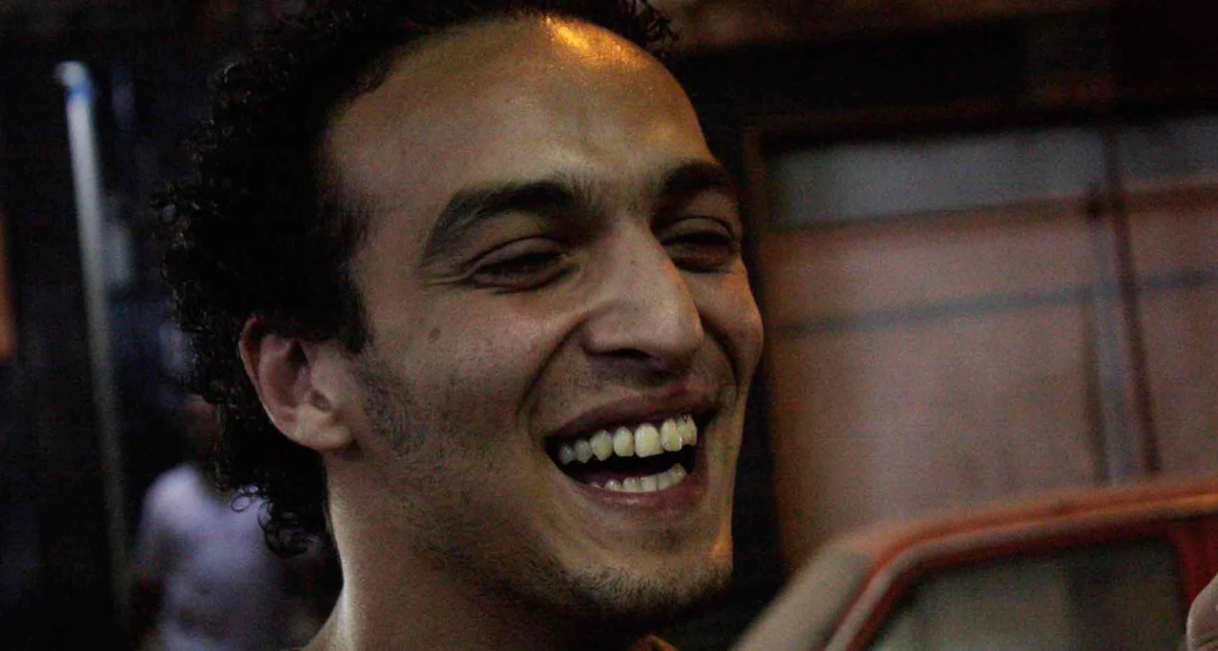 Mahmoud Abou Zeid, also known as Shawkan, laughs at the camera.