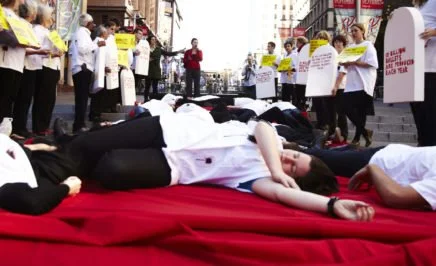 Amnesty supporters stage a 