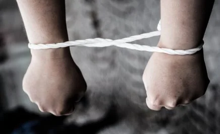 Hands bound at a protest against torture in Uzbekistan