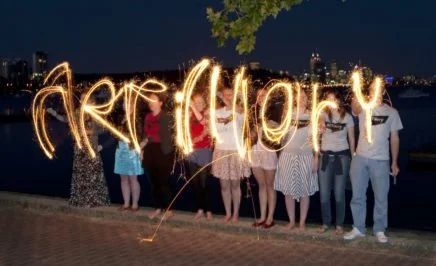 Activists spell out the word artillery with sparklers