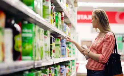 A woman shopping inside a supermarket.