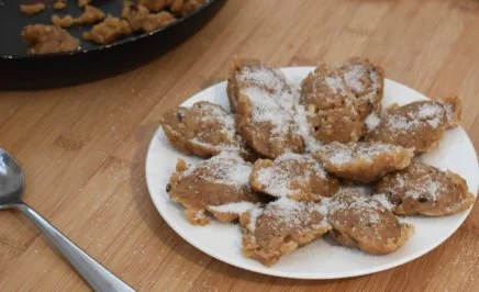 a plate of halva dusted in sugar