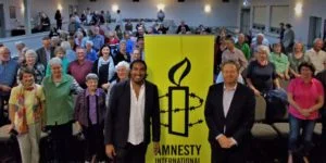 Refugee Campaigner Shankar and Davide Mann with the Wagga Wagga group behind them