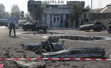 Vehicles damaged in the 28 October 2020 shelling attack in a street. The fighting between Armenia and Azerbaijan over Nagorno-Karabakh resumed in late September with both countries accusing each other of provocation, declaring martial law, and mobilising their armed forces