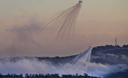 A shell from Israeli artillery explodes over Dahaira, a Lebanese border village with Israel, south Lebanon, Monday, Oct. 16, 2023 (AP Photo/Hussein Malla)