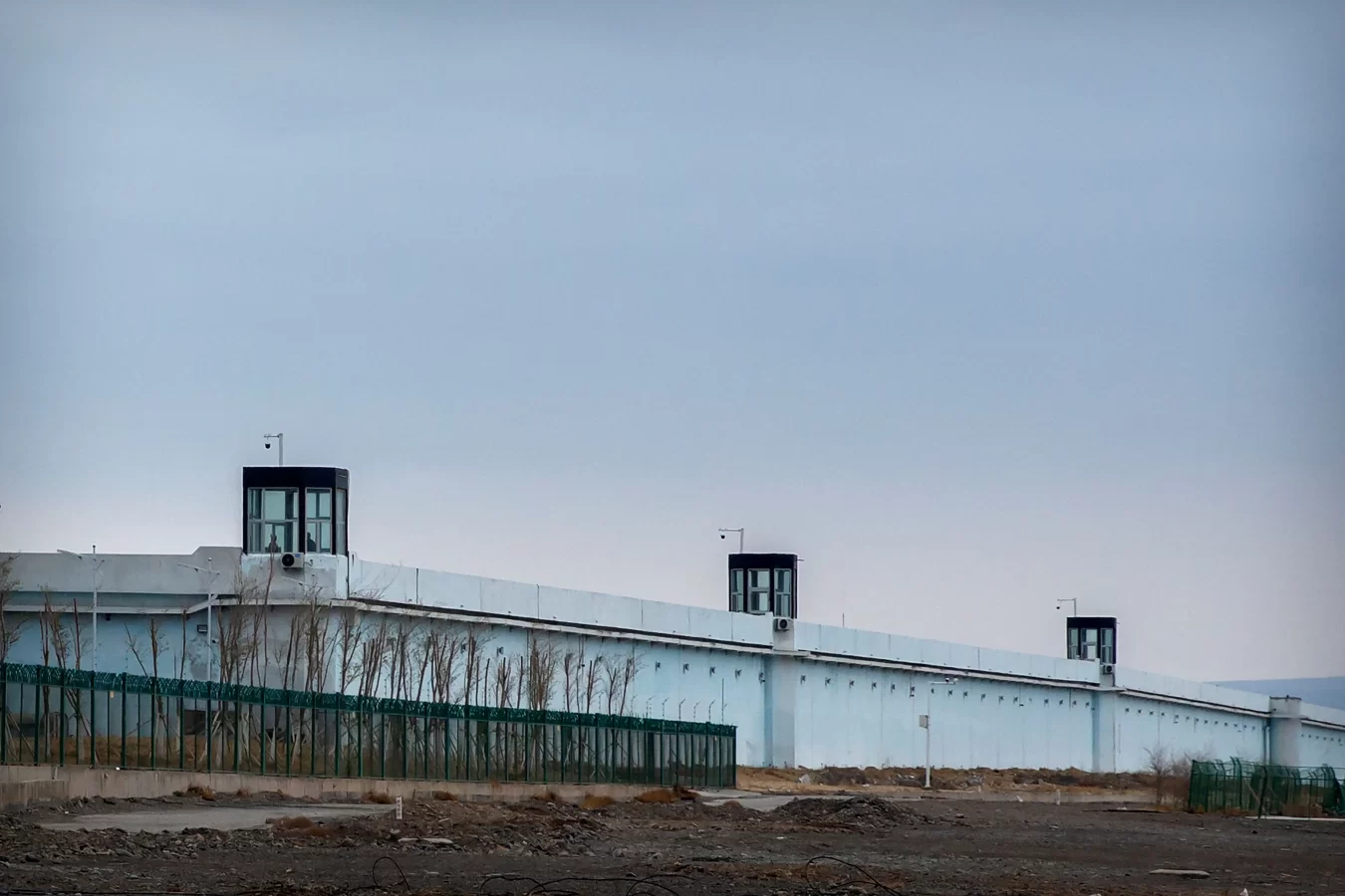 A guard stands in a tower on the perimeter of the Number 3 Detention Center in Dabancheng in Xinjiang Uyghur Autonomous Region on April 23, 2021.