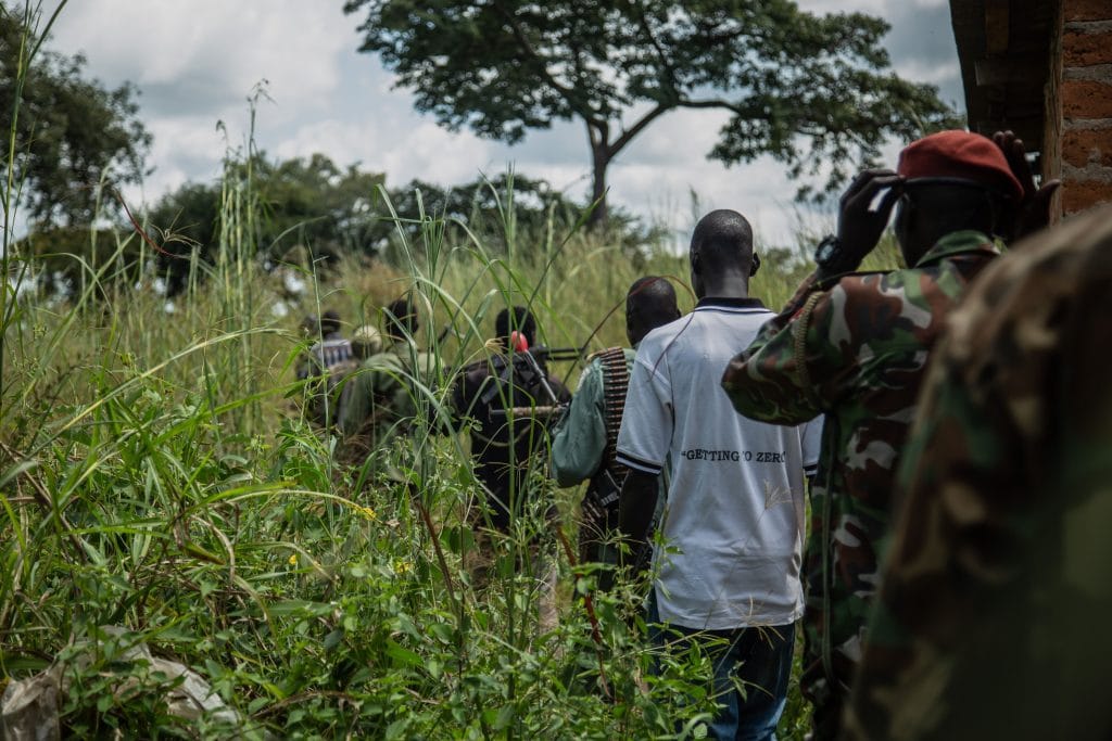 Rebels of the Sudan People's Liberation Movement-in-Opposition (SPLM-IO), a South Sudanese anti-government force, patrol around their base on September 22, 2018, in Panyume, South Sudan, near the border with Uganda. - Despite a peace deal being signed by the President of South Sudan, Salva Kiir, and opposition leader Riek Machar on September 12, conflict in Central Equatoria continues as both warring parties fight for control.